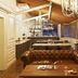 The Stay Galata in Istanbul lounge with leather sofa, chandelier, bar shelves and fireplace