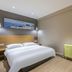 Super 8 by Wyndham Beijing Xi Zhi Men guest room with double bed and wall art in Beijing