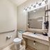 Best Western La Grange Inn & Suites bathroom with granite vanity, mirror lights, toilet and grab bars