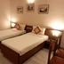The Citi Inn Jamshedpur twin room with two single beds and bedside lamps