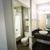 Motel 6 Ft Pierce bathroom with vanity, mirror, sink, toilet and bathtub in Fort Pierce