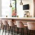 Leonardo Hotel Dresden Altstadt bar with velvet stools, pendant lights, wall TV and bottle display
