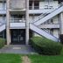 Premiere Classe Bethune - Fouquières Les Béthune exterior with twin staircases and trimmed hedges in Béthune
