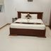 Volga Apartment Hotel in Mũi Né bedroom with a double bed, white tile floor, and wardrobe