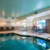Indoor pool at Fairfield Inn & Suites by Marriott Greenwood with lounge chairs and skylight