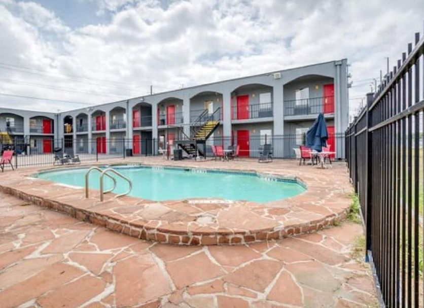 OYO Hotel San Antonio Lackland Air Force Base West in San Antonio with an outdoor pool and two-story motel building