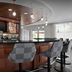 Hotel Indigo Jacksonville-Deerwood Park lobby bar with patterned stools and hanging pendant lights in Jacksonville