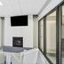Red Roof Inn & Suites Fayetteville-Fort Bragg lobby seating area with fireplace and wall-mounted TV