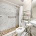 Hollywood by the Sea Hollywood bathroom with shower, toilet, sink and mirror