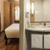 ibis Sao Paulo Interlagos bathroom vanity beside compact guest room in Sao Paulo