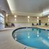 Indoor pool at Fairfield Inn & Suites by Marriott Clarksville in Clarksville with lounge chairs