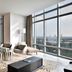 Four Seasons Hotel Bengaluru at Embassy One suite with floor-to-ceiling windows and city view in Bengaluru