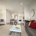 Quest Sanctuary Lakes Melbourne apartment living room with kitchen, sofa, TV, and dining area