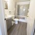 Lincoln Inn Fredericton bathroom with vanity, toilet, and shower-tub combo in Fredericton