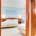 Europa Stabia Hotel in Castellammare di Stabia: guest room with twin beds and a teal-tiled bathroom