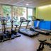 Residencia Universitaria Resa Los Abedules fitness room in Pamplona with treadmills, ellipticals and weights