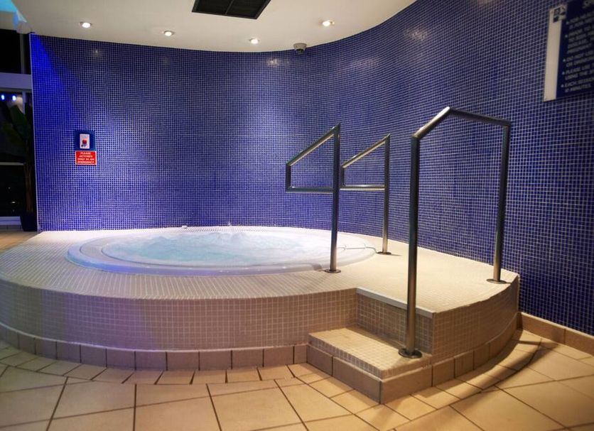 The Lodge At Meyrick Park in Bournemouth features an indoor spa pool with tiled steps and handrails