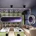Master Hotel Huizhou lounge with beige sectional seating, central tables, and purple accent lighting