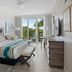 The Capitana Key West in Key West guest room with balcony doors and tropical view