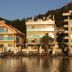 Orsmaris Boutique Hotel in Marmaris with beachfront loungers, pool and sea-view hotel buildings