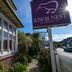 Kiwi's Nest Budget Accommodation & Backpackers sign and street view in Dunedin