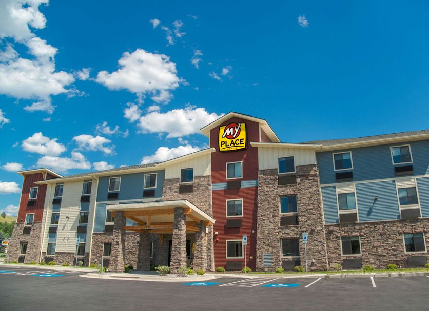 My Place Hotel - Missoula, MT exterior with stone facade and blue sky