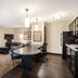 Sonesta Simply Suites Pittsburgh Airport room with kitchen, dining table, sofa and seating area in Pittsburgh