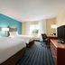 Fairfield Inn by Marriott Kankakee Bourbonnais room with two beds, desk and window view in Bourbonnais
