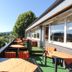 Alpina Löwen Hotel in Sankt Märgen terrace with outdoor tables and scenic countryside views