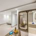 Sunrise Holidays Resort -Adults Only in Hurghada, spacious suite with mirrored wardrobe and seating area
