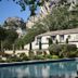Baumanière - Les Baux de Provence with outdoor pool and mountain backdrop in Les Baux-de-Provence