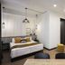 Kantar Hotel Yerevan room with bed, sofa, coffee table and pendant lights