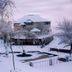 Himgiri Resorts in Dharamshala amid snow-covered grounds with a frozen outdoor pool and trees