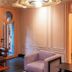 Ignacia Guest House Mexico City lobby with lounge chairs, paneled walls and glass doors