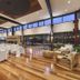 Eight Willows Retreat Metricup dining hall with set tables, wood floors and floor-to-ceiling windows