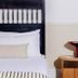 Dye House Providence guest room with bed, bedside table, and decorative lamp