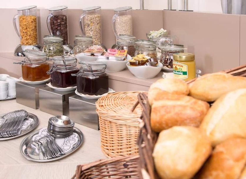 Parkhotel Lippstadt breakfast buffet with bread rolls, jams, cereals and condiments in Lippstadt