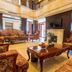 Beijing Jinyu Badaling Resort in Beijing lobby with ornate seating, coffee table, and wall-mounted TV