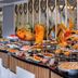 Grand Uysal Apart Hotel Alanya breakfast buffet with pastries, fruit, and hot dishes