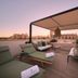 Sant Francesc Hotel Singular rooftop terrace in Palma de Mallorca with lounge seating and sunset view