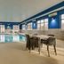 Hampton Inn & Suites St. Louis-Edwardsville indoor pool with tables and chairs in Glen Carbon