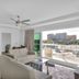 The Avalon Club in Clearwater Beach living room with balcony view of the waterfront and nearby buildings