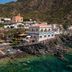 Hotel L'ariana Isole Eolie - Una Esperienze in Leni, cliffside hotel overlooking clear turquoise sea