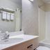 Quality Inn Rosebud Casino bathroom with vanity sink and shower-tub combo in Mission