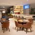 Blue Tree Towers Caxias do Sul lobby bar with lounge seating, fireplace, and high stools