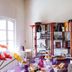 La Villa Des Violettes in Toulouse: colorful dining room with set table, floral decor, and bright window