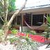 Lazy Dog Bed & Breakfast in Boracay with tropical garden walkway and hammock outside rooms