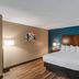 The Hotel Saratoga, an Ascend Collection Hotel in Saratoga Springs guest room with king bed and wood flooring