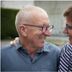 B&B De Laak in Bilzen: smiling older couple talking closely outdoors
