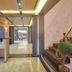 East Dragon Hotel Taipei City lobby with marble floor, reception desk, and staircase